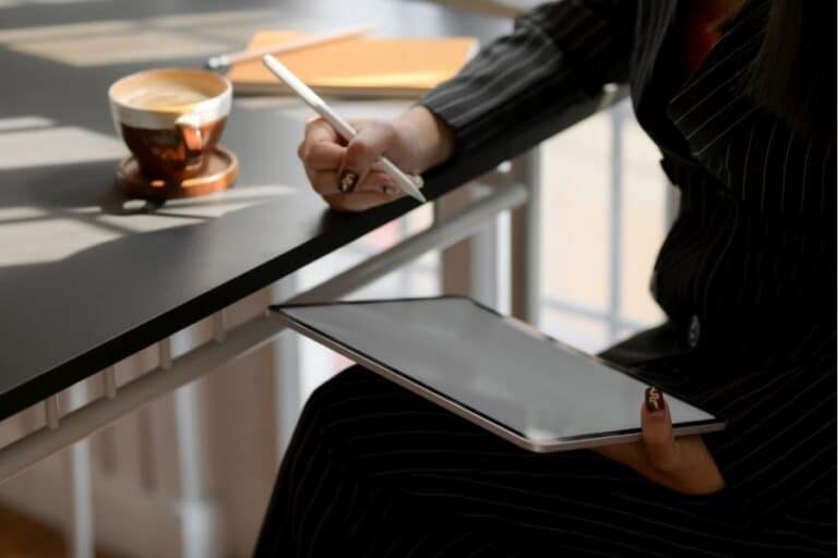 Woman with Tablet Addressing Personal Development